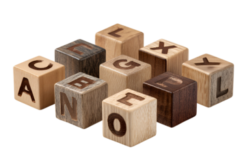 Wooden alphabet blocks scattered on black background