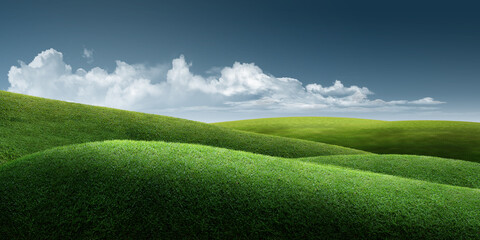 green field and blue sky/Green grass meadow field with rural valley landscape in nature.
