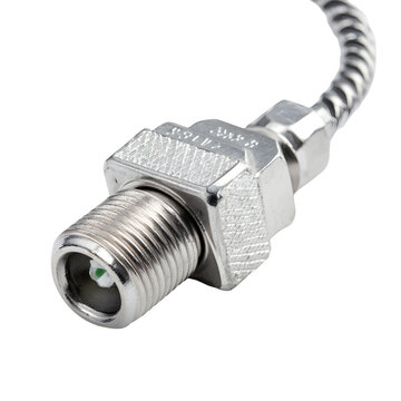 Close-up of a metallic industrial inductive proximity sensor with a threaded connector isolated on a white background