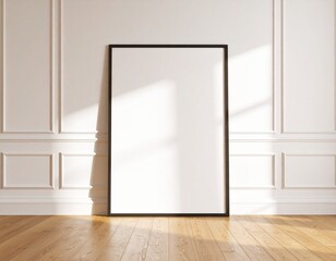 Empty vertical black frame mockup on a wooden floor against a classic white wall with sunlight.