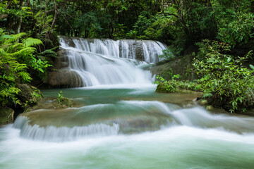 Cascading tropical waterfall with emerald stream at Huay Mae Khamin National Park, Kanchanaburi, Thailand