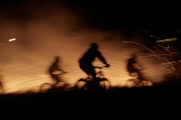 Obraz premium Cyclists navigate through mesmerizing fire trails during a night festival showcasing vibrant sparks and excitement in a captivating outdoor setting