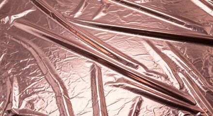 Metallic rose gold foil fabric with reflective crinkled surface, shimmering highlights and fine details, close-up full frame textile photography for luxury packaging and elegant branding