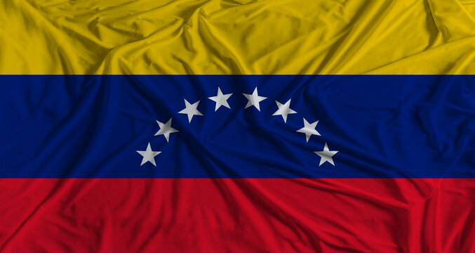 Venezuelan flag with fabric texture background. National flag of Venezuela with cloth texture