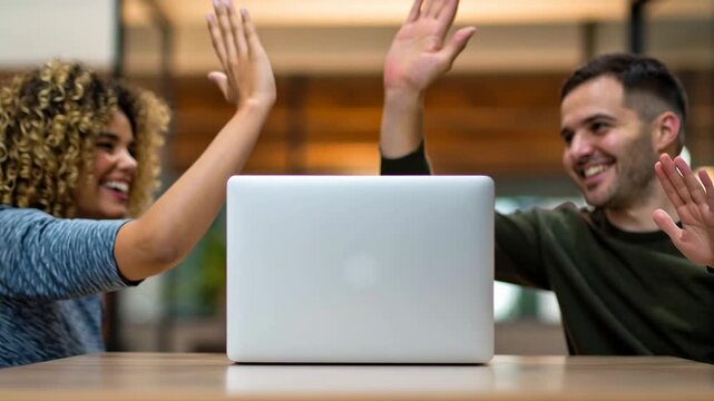 Work and productivity thrive through teamwork as colleagues celebrate success with laptop modern office, highlighting teamwork, productivity