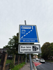 Bus lane sign and surveillance camera notice in Manchester, UK