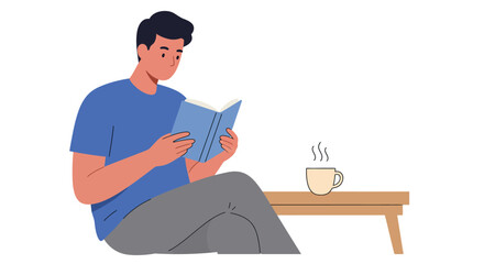 A young man sits comfortably on the floor reading a book, with a steaming cup of coffee on a small wooden table next to him.