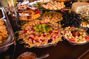 Salad with cheese, Brazilian snack. Brazilian cheese in pieces with salad, tomatoes, olives, onion and lettuce