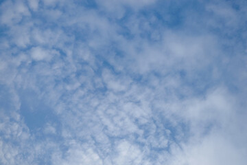 Soft white cloud texture background in blue sky on a sunny day. Climate and weather concept. For graphic design and banners