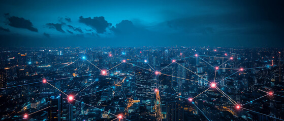 Fototapeta premium A view of the city at night with a network of glowing connections between buildings — for discussing network technologies, smart cities, and digital infrastructure.
