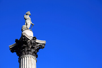 Nelson’s Column in Trafalgar Square London England, UK, erected to celebrate Horatio Nelson's  victory at Trafalgar over Napoleon in 1805. travel destination stock photo image with copy space