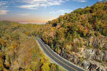 American highway in North Carolina Appalachian mountains in fall season with fast moving traffic. Interstate transportation concept