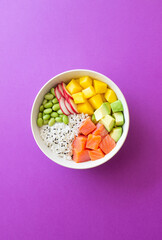 Hawaiian poke bowl with rice, salmon, avocado, radish, edamame and mango. Healthy eating. Diet.