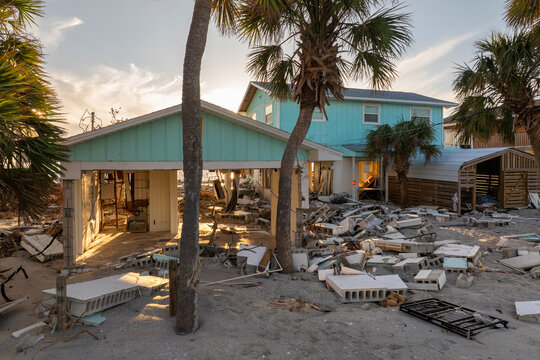 Natural disaster and its consequences. Hurricane destroyed houses roof and walls in Florida coastal area