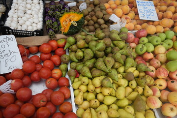 Vibrant fresh fruit and vegetable market stall in Benidorm, Spain showcasing colorful produce and local delicacies