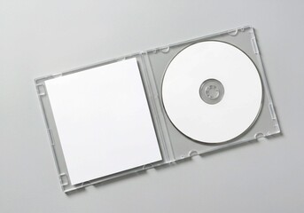 stack of cds, Open clear plastic CD jewel case with blank white disc and insert for branding. Mock-up of compact disc packaging on soft gray background. Represents digital storage, music or software.