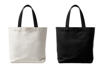 Two blank canvas tote bags, one light beige, one black, with black leather handles