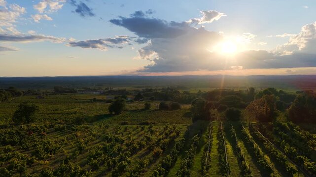 Aerial view of dramatic sunset above Gigondas and Les Dentelles de Montmirail vineyards at the Mont Ventoux