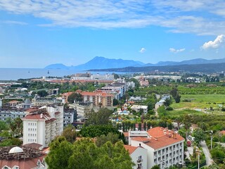 Panoramic view of Mediterranean coastal resort village with gardens and hotel in Camyuva, near Kemer, Antalya, Turkey.