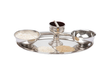 Silver puja thali with diya, kumkum bowl, and rice grains, shiny polished finish, isolated on transparent background 