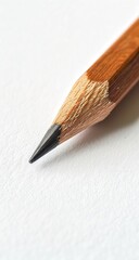 Close-up of a pencil tip on white paper