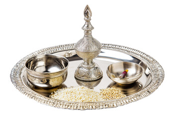 Silver puja thali with diya, kumkum bowl, and rice grains, shiny polished finish, isolated on transparent background 