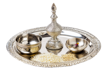 Silver puja thali with diya, kumkum bowl, and rice grains, shiny polished finish, isolated on transparent background 