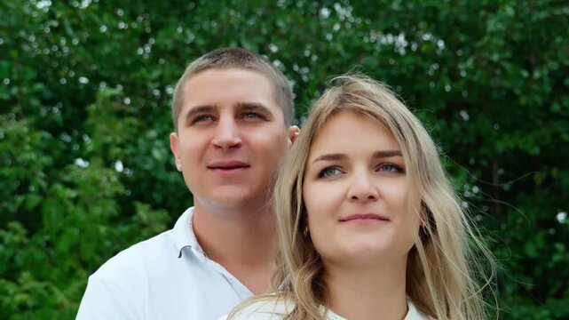 Portrait of a couple in love, looking piercingly in the same direction. We are together, we are a young family.
