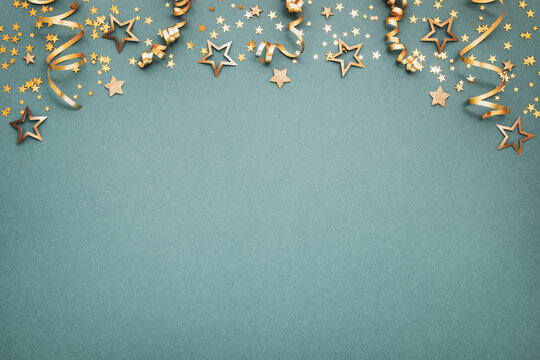 New Year, Christmas or birthday festive background top view. Celebration composition with golden confetti stars and serpentine party streamers. - Powered by Adobe