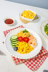 Healthy Mixed Salad Bowl with Corn Kernels Prawns Pasta and Fresh Vegetables on White Background