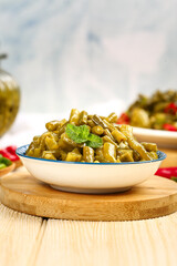Cooked Cowpea Beans with Mint Garnish - Traditional Legume Dish Preparation on Wooden Board