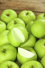 Fresh Green Apples Ready to Pick with Water Droplets on Wooden Background