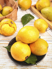 Fresh Yellow Passion Fruits with Creamy Pulp on Rustic Wooden Table