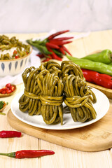 Fermented Sour Cowpea Long Beans Traditional Farmers Food Preparation with Fresh Vegetables and Chili Peppers