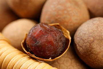 Fototapeta premium Dried Longan Fruit with Cinnamon Sticks - Asian Tropical Food Delicacy Photography