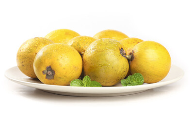 Fresh Golden Quinces on White Plate with Mint Garnish - Aromatic Fruit Display