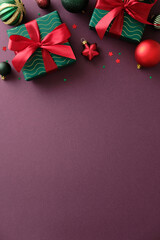 Christmas vertical banner design. Top view vintage gift boxes, baubles, stars on maroon background.