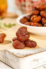 Dried Litchi Guiwei Variety from Fujian Gaozhou on Wooden Board - Traditional Chinese Dried Fruit Snack