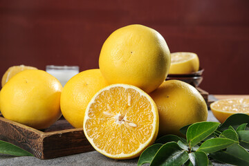 Fresh Fujian Pomelo Grapefruit with Golden Flesh on Wooden Tray - Asian Citrus Fruit Display