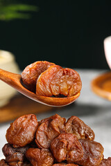 Dried Litchi Fruit from Fujian Gaozhou China Traditional Preserved Snack with Wooden Spoon