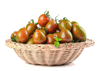 Fresh Heirloom Tomatoes with Sage in Wicker Basket - Organic Vegetables Display