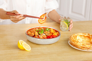 Spicy Seafood Stew with Shrimp and Clams Being Eaten with Chopsticks Hot Sauce Cuisine