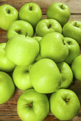 Fresh Green Apples from Shaanxi Province on Wooden Background - Tree-Ripened Fruit Ready for Picking