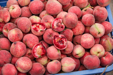 Fresh Red Flesh Peaches Pile in Market Crate - Ripe Stone Fruit Display