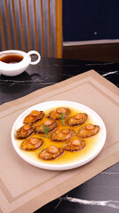 Dried Abalone Sea Cucumber Dishes in Golden Sauce with Fresh Herbs and Tea