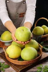 Freshly Picked Fujian Pomelo - Sweet Juicy Citrus Fruits in Wicker Baskets with Woman in Apron