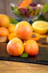 Fresh Xinjiang Apricots on Wooden Board - Organic Stone Fruit from China's Yili Region