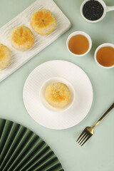 Traditional Golden Mooncakes with Tea - Delicious Festival Food with Crispy Skin and Nutmeg