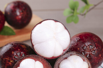 Fresh Mangosteen Fruits from Thailand with White Flesh Segments Exposed