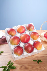 Premium Red Apples from Yunnan Province China in Gift Box Packaging on Wood Table
